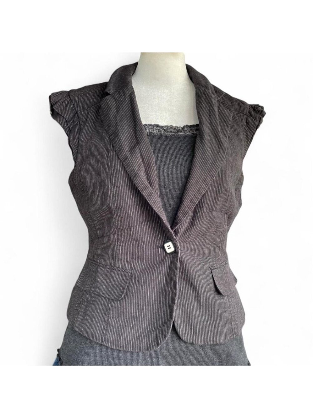Gray pinstripe tailored vest with ruffle sleeves and button detail
